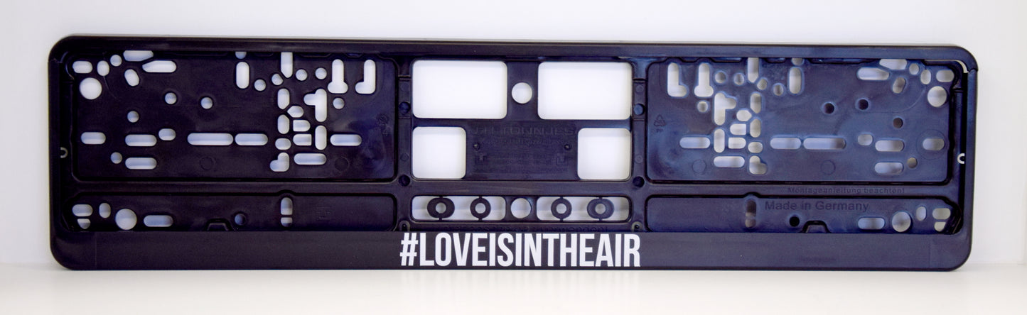 Auto numura turētājs ar uzrakstu - #Love Is In The Air Latsign